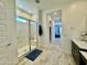 Modern main bathroom featuring a frameless glass shower with a built-in seat at 20171 W Cheery Lynn Rd, Buckeye, AZ 85396