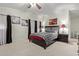 Cozy bedroom featuring a decorative ceiling fan, neutral walls, art pieces, and a comfortable patterned bed at 205 S Higley Rd # 300, Mesa, AZ 85206