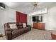 Inviting living room featuring comfortable seating, a TV, and a ceiling fan at 205 S Higley Rd # 300, Mesa, AZ 85206