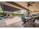 Spacious backyard featuring a covered patio, seating, and a pool at 21231 E Nightingale Rd, Queen Creek, AZ 85142