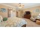 Spacious bedroom featuring a ceiling fan and an entrance into the bathroom at 21231 E Nightingale Rd, Queen Creek, AZ 85142