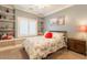 Bedroom features shelving and a queen size bed with a red pillow at 21231 E Nightingale Rd, Queen Creek, AZ 85142