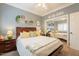 Bedroom with decor and a mirrored closet showcasing the queen size bed at 21231 E Nightingale Rd, Queen Creek, AZ 85142