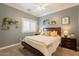 Bedroom featuring a ceiling fan, a queen bed, and decor on the walls at 21231 E Nightingale Rd, Queen Creek, AZ 85142