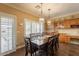 Traditional dining room with hardwood floors, wood table and chairs, buffet and decorative lighting at 21231 E Nightingale Rd, Queen Creek, AZ 85142