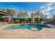 Beautiful backyard pool with a slide, basketball hoop, and lush landscaping, perfect for outdoor fun and relaxation at 21231 E Nightingale Rd, Queen Creek, AZ 85142
