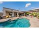 Inviting backyard pool and patio area featuring comfortable lounge seating and an attached pergola at 21231 E Nightingale Rd, Queen Creek, AZ 85142