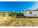 Spacious backyard featuring a grassy area and garden space, ready for landscaping and outdoor enjoyment at 214 W June Cir, Mesa, AZ 85201
