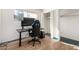 Bedroom featuring a hardwood floor, with closet and natural light from the window at 214 W June Cir, Mesa, AZ 85201