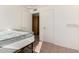Small bedroom features full bed, a door to a closet, and white walls at 214 W June Cir, Mesa, AZ 85201