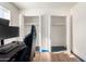 Bedroom featuring two bright closets with natural light from the window at 214 W June Cir, Mesa, AZ 85201