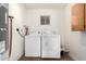 The laundry room includes washer and dryer and plenty of room for storage at 214 W June Cir, Mesa, AZ 85201