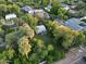 Bird's-eye view reveals a residence nestled amid lush palm trees and verdant surroundings, highlighting its appeal at 220 E 14Th St, Tempe, AZ 85281