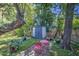Private backyard with storage shed, seating area, and lush greenery for relaxing or entertaining at 220 E 14Th St, Tempe, AZ 85281