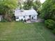 Aerial view showcasing the expansive backyard, patio area, mature trees, and shed, providing ample space at 220 E 14Th St, Tempe, AZ 85281