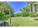 Expansive backyard featuring lush green grass and mature trees, perfect for outdoor activities at 220 E 14Th St, Tempe, AZ 85281