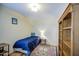 This bedroom includes a bed, built-in bookcase and accent rug at 220 E 14Th St, Tempe, AZ 85281