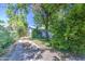 Quaint single-story home with blue trim partially shaded by mature trees at 220 E 14Th St, Tempe, AZ 85281