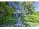 A well-maintained single-story home framed by lush greenery and charming curb appeal at 220 E 14Th St, Tempe, AZ 85281