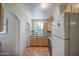 Practical kitchen layout with a laundry area and colorful tile accents at 220 E 14Th St, Tempe, AZ 85281