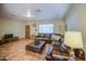 Spacious living room featuring a large leather sectional and tile flooring at 220 E 14Th St, Tempe, AZ 85281