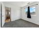 Carpeted bedroom with large window and closet is bright and airy at 2395 S Arizona Rd, Apache Junction, AZ 85119