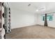 Spacious bedroom with neutral carpet and a ceiling fan, showcasing an open closet and window view at 2395 S Arizona Rd, Apache Junction, AZ 85119