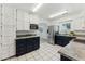 Well-lit kitchen features stainless steel appliances, granite countertops, and white tile floors at 2395 S Arizona Rd, Apache Junction, AZ 85119