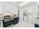 Well-lit kitchen featuring stainless steel appliances and a laundry area at 2395 S Arizona Rd, Apache Junction, AZ 85119