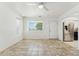 Bright living room featuring tile floors, a ceiling fan, and lots of natural light at 2395 S Arizona Rd, Apache Junction, AZ 85119