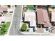 An aerial view shows a well-maintained home with a private pool, green lawn, and mature landscaping at 3016 N 109Th Ave, Avondale, AZ 85392
