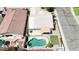 Aerial view of a home with a kidney-shaped pool, patio area, and well-manicured landscaping at 3016 N 109Th Ave, Avondale, AZ 85392