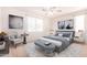 Inviting bedroom featuring plush bedding, decorative pillows, and abundant natural light at 3016 N 109Th Ave, Avondale, AZ 85392