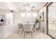 Bright dining area with white round table, contemporary chairs, and plenty of natural light at 3016 N 109Th Ave, Avondale, AZ 85392