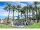 Community waterfall and sign surrounded by palm trees in a meticulously maintained community at 3016 N 109Th Ave, Avondale, AZ 85392