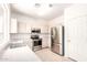 This kitchen is light and airy with stainless steel appliances and ample counter space at 3016 N 109Th Ave, Avondale, AZ 85392