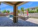 Charming backyard featuring an outdoor seating area, pool, and well-manicured lawn for relaxation and entertainment at 3436 E Gary Way, Gilbert, AZ 85234