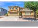 Two-story home featuring a two-car garage, well-maintained landscaping, and a basketball hoop in the driveway at 3436 E Gary Way, Gilbert, AZ 85234