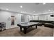 Spacious game room with pool table, comfortable sofa, recessed lighting, and plantation shutters at 3436 E Gary Way, Gilbert, AZ 85234