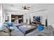 Spacious living room features plush sectional sofa, ceiling fan, and access to kitchen at 3436 E Gary Way, Gilbert, AZ 85234