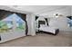Spacious main bedroom filled with natural light from large windows, with a white bed at 3436 E Gary Way, Gilbert, AZ 85234
