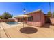 Backyard featuring private pool and patio with shaded area at 3823 W Berridge Ln, Phoenix, AZ 85019