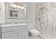 Updated bathroom featuring marble shower and vanity at 3823 W Berridge Ln, Phoenix, AZ 85019