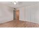 Bedroom featuring wood-look flooring, closet, and a ceiling fan at 3823 W Berridge Ln, Phoenix, AZ 85019