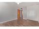 Bedroom featuring wood-look flooring, closet, and a ceiling fan at 3823 W Berridge Ln, Phoenix, AZ 85019