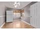 Dining room with hardwood floors, natural light, and white appliances at 3823 W Berridge Ln, Phoenix, AZ 85019