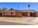 Quaint single-story home with well-kept front yard at 3823 W Berridge Ln, Phoenix, AZ 85019
