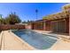 Backyard pool with clear blue water and desert landscaping at 3823 W Berridge Ln, Phoenix, AZ 85019