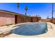 Backyard pool with diving board and privacy fence at 3823 W Berridge Ln, Phoenix, AZ 85019