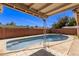 In-ground pool in backyard at 3823 W Berridge Ln, Phoenix, AZ 85019